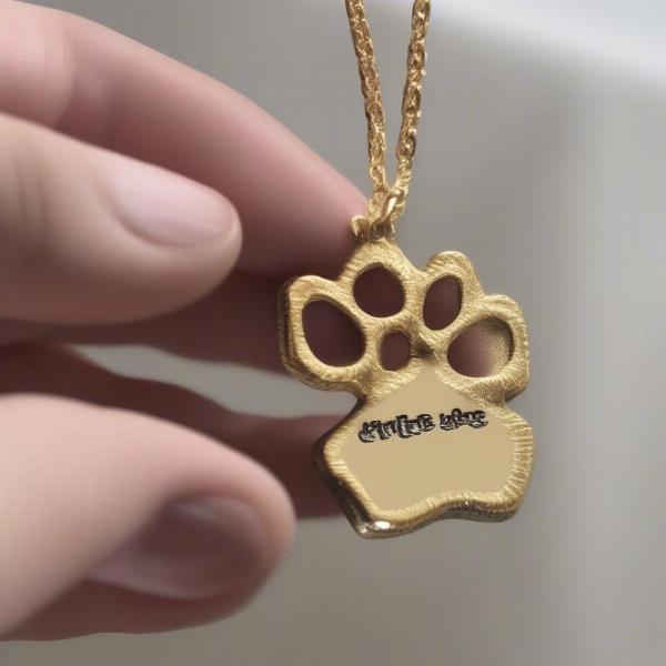 Cleaning a gold dog paw necklace