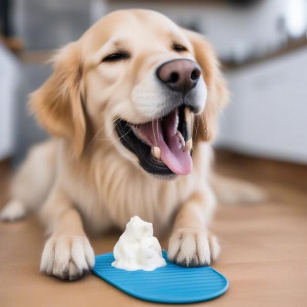 Dog enjoying plain yogurt on a lick mat