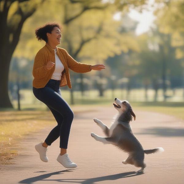 A woman playing fetch with her dog in a park