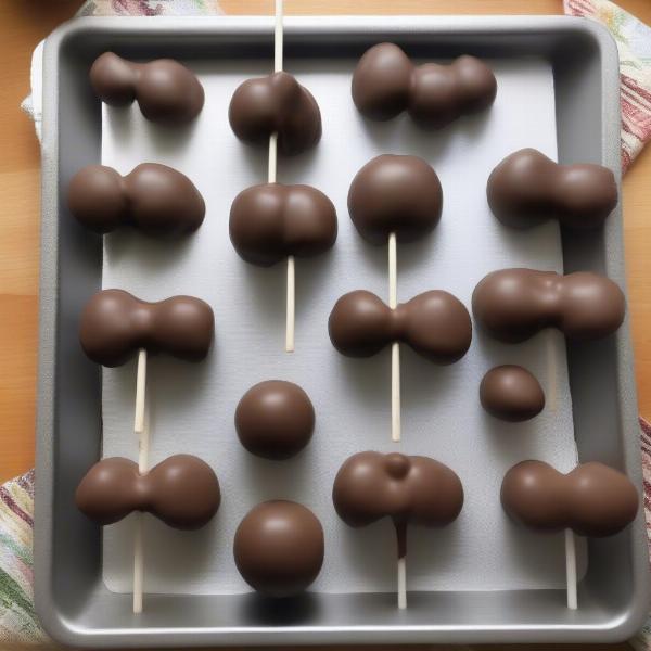 Baked dog cake pops ready for dipping and decorating.