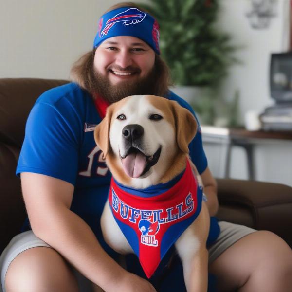 Buffalo Bills fan with their dog wearing team colors.