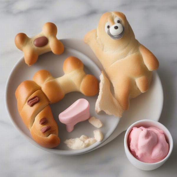 Creative dog-themed party snacks, such as "hot diggity dogs," "bark" scoops, and bone-shaped sandwiches.