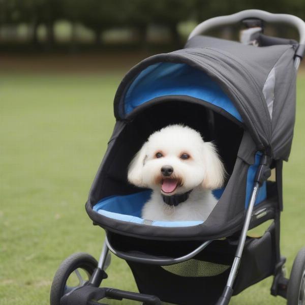 A happy dog enjoying a ride in the Innopet Sporty stroller