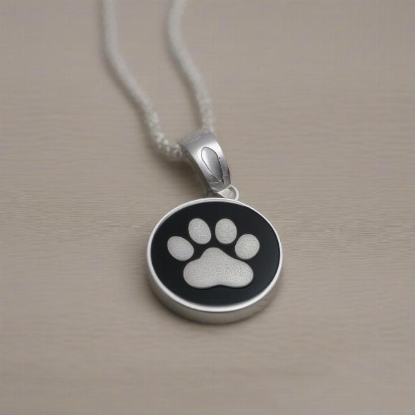 A close-up of an engraved dog ashes pendant