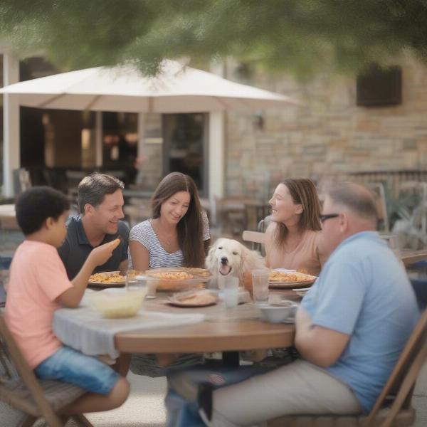 Family dining with their dog at a dog-friendly restaurant in San Marcos.