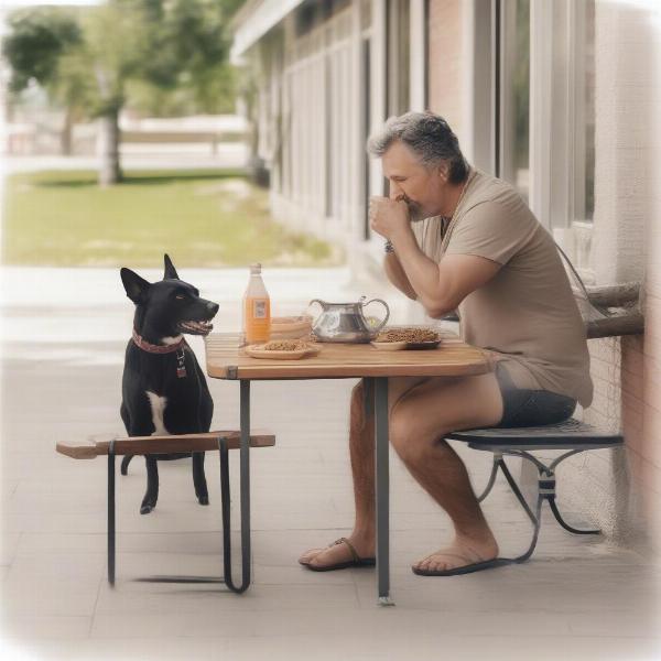 Dog enjoying a meal on a patio with its owner